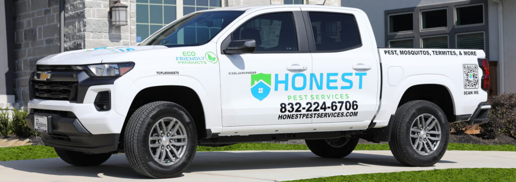 Honest Pest Services branded white Chevrolet Colorado service truck