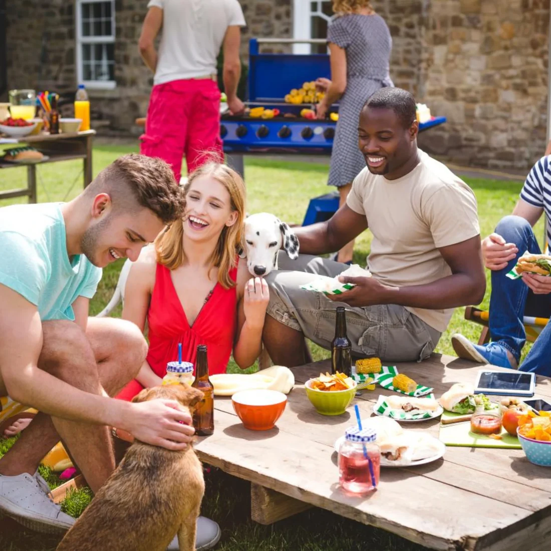 Friends and family sharing a backyard meal, from the original Honest homepage